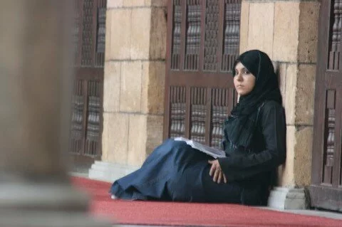 Muslim girl sitting in cairo university