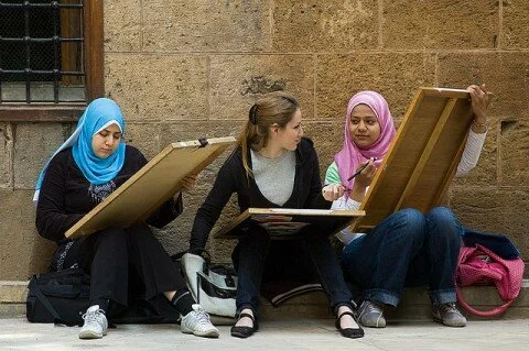 young Muslim girl doing paintin egypt